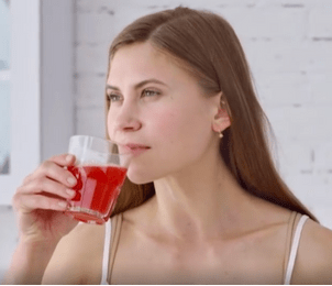 Girl drinking Ikaria Lean Belly Juice